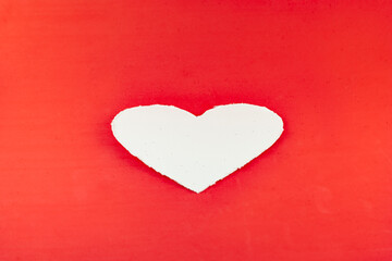 White heart on red background
