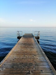 wooden pier on the sea, bright blue sky, morning, Slovenia, Isola, Izola