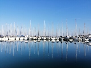 Fototapeta premium Sailing boats, ship in marina, blue sky, Slovenia, Izola, Isola