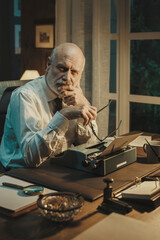 Vintage style businessman working in his office