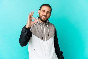 Fototapeta premium Young man with long hair look cheerful and confident showing ok gesture.