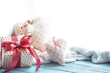 Festive composition for Valentine's Day with a gift box and decor elements copy space.