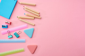 Stationery supplies closeup, pink background