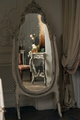 Elegant floor mirror in classic style interior, photo studio.