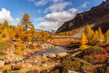 Arpy Lake and the surrounding area during the fall and changing of the colors. Foliage, reflection and snowy peaks