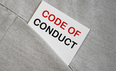 CODE OF CONDUCT text on a whire sticker in a pocket. Buseinss concept.