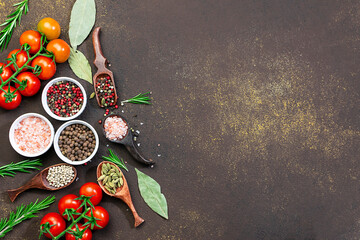 Assortment of spices, herbs and vegetables on stone rustic background with copy space for your design. Spices market banner template. Food blog cover mock 