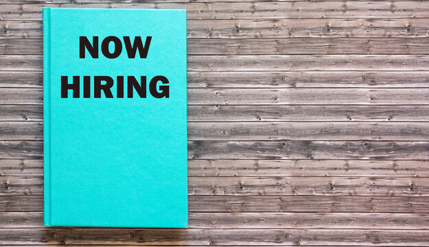 Now the hiring is written on a green pad and on a wooden background. illustration design