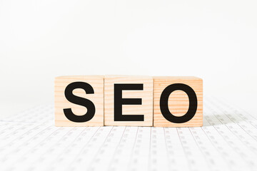 a word SEO on wooden cubes. business concept. business and Finance