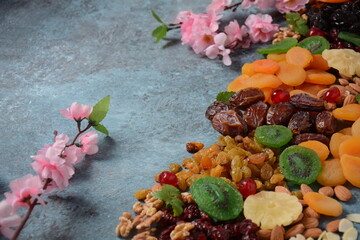 Mix of dried and sun-dried fruits, and nuts. Kiwi, apricot. Symbols of the Jewish holiday of Tu BiShvat