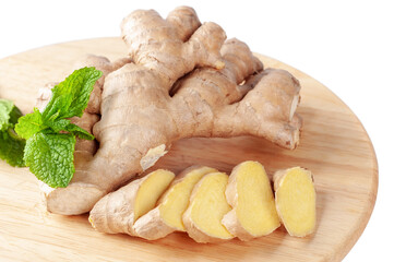 Fresh sliced ginger root and green mint leaves