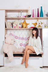 A young woman in a white dress smiling on the Valentine's Day