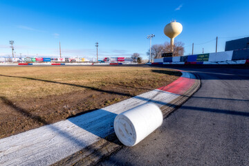 Car racing track with protection barrel