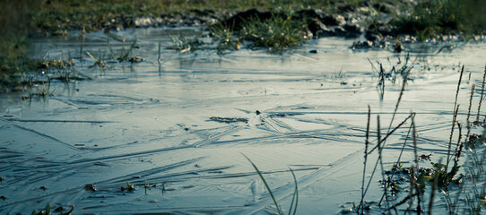First snow and frost on a dirt road