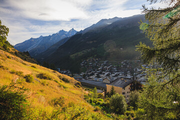 Zermatt in the swiss alps wallis with trees forest wood sunlight matterhorn view path