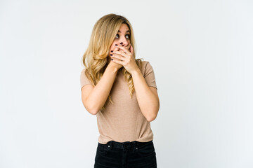 Young caucasian blonde woman thoughtful looking to a copy space covering mouth with hand.