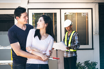Asian young couple, husband and attractive wife are happiness together for renovating the old house...