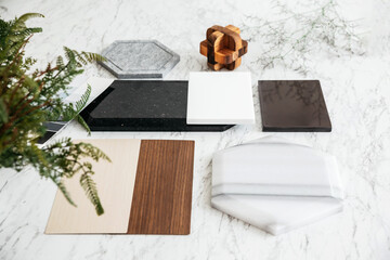 Material Selections including Granite tile, Marble tile, Acoustic tile, Walnut and Ash Wood Laminate with plant on marble top table.