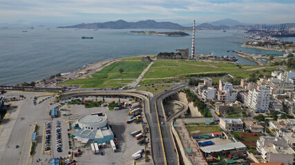 Aerial drone view from abandoned public fertiliser factory as seen at sunny winter slightly cloudy morning, Piraeus main port, Attica, Greece