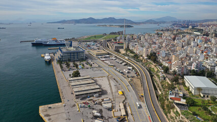 Aerial drone photo of busy port of Piraeus, the largest in Greece and one of the largest passenger ports in Europe as seen from old fertiliser factory, Attica, Greece 