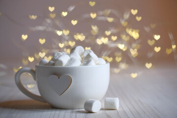 white cup with heart and lace lights, marshmallow