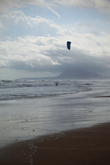 An image of the beach on a cloudy summer day