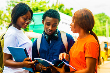 Three young african students studying together