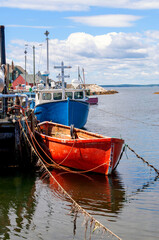Fishing boats tied to a wharf in Nova Scotia, Canada