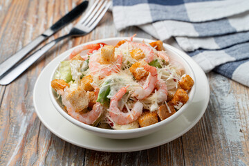 Caesar salad with boiled prawns, clean light photo