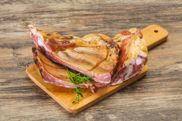 Smoked pork ribs over the wooden background