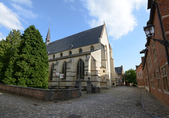 Fototapeta na wymiar Leuven Grand Beguinage - Church Saint Jean Baptiste facade - UNESCO World Heritage Site, Belgium
