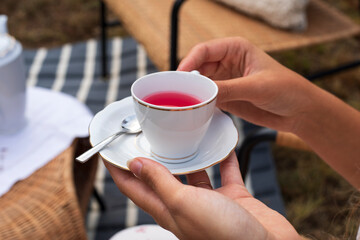 A cup of red tea.