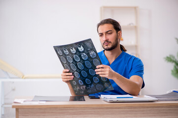 Young male doctor radiologist working in the clinic