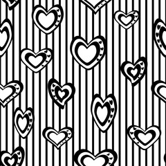 Seamless vector pattern. Stylized black and white hearts on a striped background.