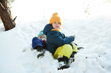 Children have fun playing in the winter snow Park.