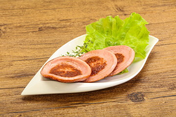 Roasted sausage slice in the plate