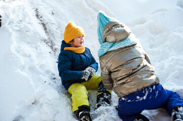 Children have fun playing in the winter snow Park.