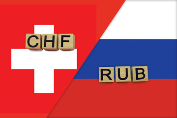 Switzerland and Russia currencies codes on national flags background