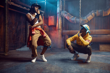 Rappers dancing, break-dance performing in studio - obrazy, fototapety, plakaty