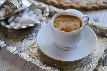 Traditional Turkish coffee over rustic tray