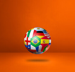 Obraz premium Football soccer ball with national flags on a orange studio background