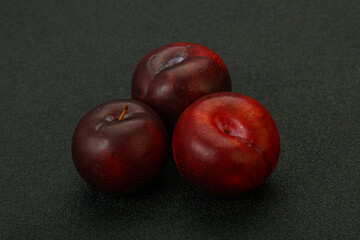 Ripe sweet plum fruit heap