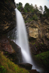 Fototapeta na wymiar Fellbachfall long exposure waterfall shot in the swiss alps switzerland high fall