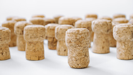 Fototapeta na wymiar Used corks plugs from different champagne producing on white background