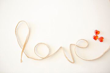 Word "love" made with rope on white background