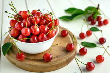 Fresh cherries in white bowl