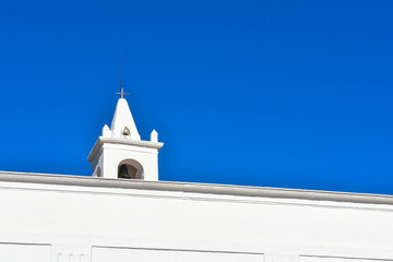 Obraz premium Ibiza, Spain - January 17, 2021: Ibiza San Miguel Sant Miquel de Balansat white Mediterranean church on a sunny day..
