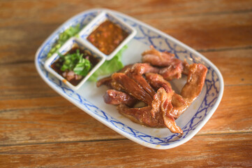 close up of Thai food on the wooden table.
