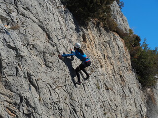 climber girl in a mountain rock