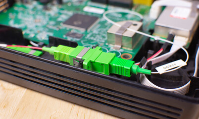 Fibre optic connector socket inside a wireless modem router
